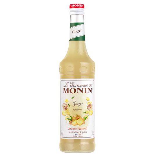 Fles van Le Concentré de Monin Ginger (70 cl), een natuurlijk gemberconcentraat met 39% gembersap, ideaal voor cocktails, mocktails en limonades. Verpakt in een elegante fles met botanische illustraties. Verkrijgbaar bij Sherlocks Place Rotterdam.